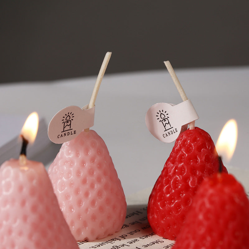 Wholesale strawberry novelty shaped party candles - Lit pink and red candles with steady flame