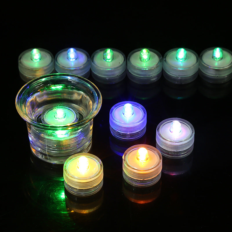 Submersible waterproof LED tea light submerged underwater illumination inside clear glass container