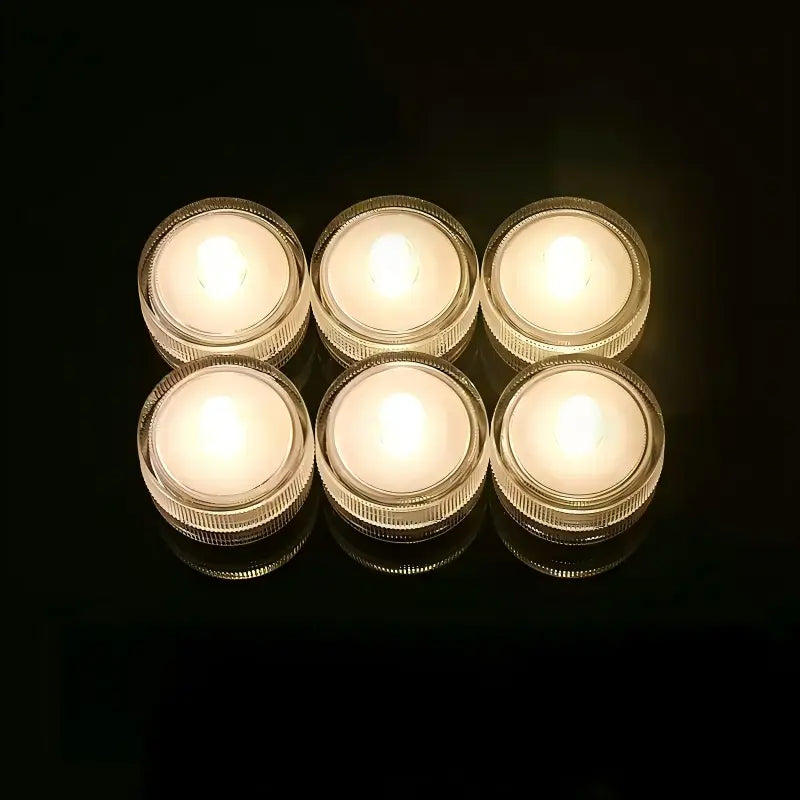 Submersible waterproof LED tea light warm white glowing units arranged in grid
