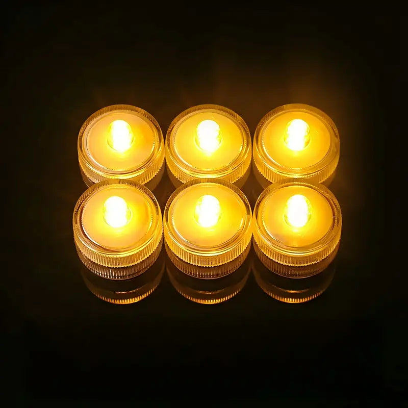 Submersible waterproof LED tea light amber yellow glowing units arranged in grid