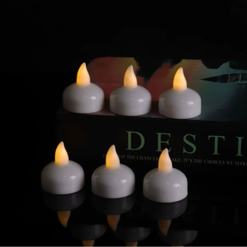 Floating LED candle 6-pack illuminated amber yellow