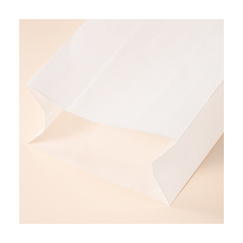 White kraft bag close-up detail of reinforced flat block bottom construction