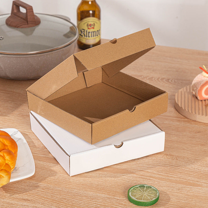 Corrugated pizza box open kraft lid stacked on closed white box