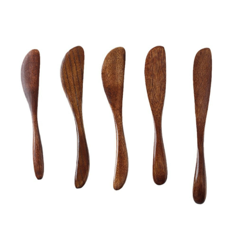 Wooden butter spreader vertical lineup five dark assorted knives