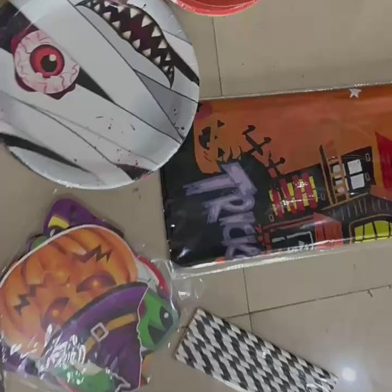 Video showing Halloween horror tableware, table covers and hanging decoration options