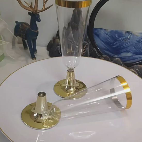 Video showing clear plastic champagne flutes with metallic rims, sizes and event table presentation