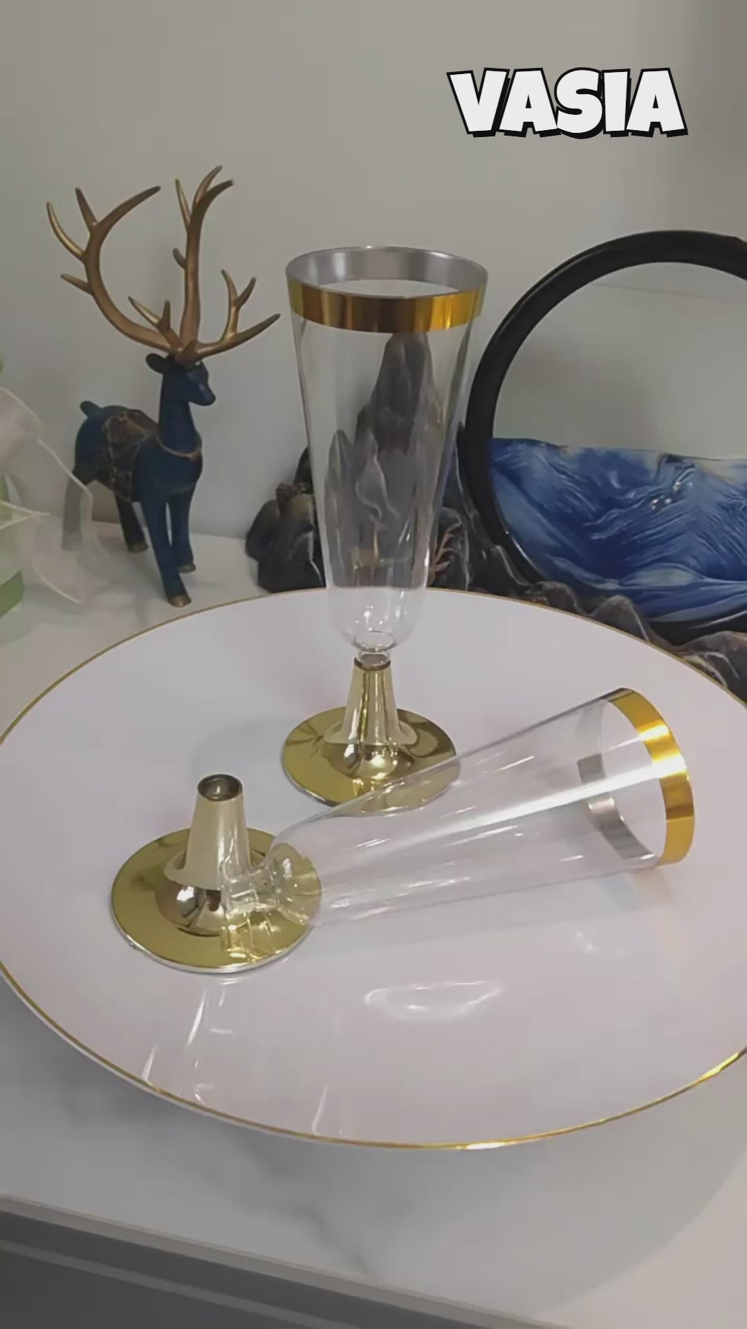 Video showing clear plastic champagne flutes with metallic rims, sizes and event table presentation