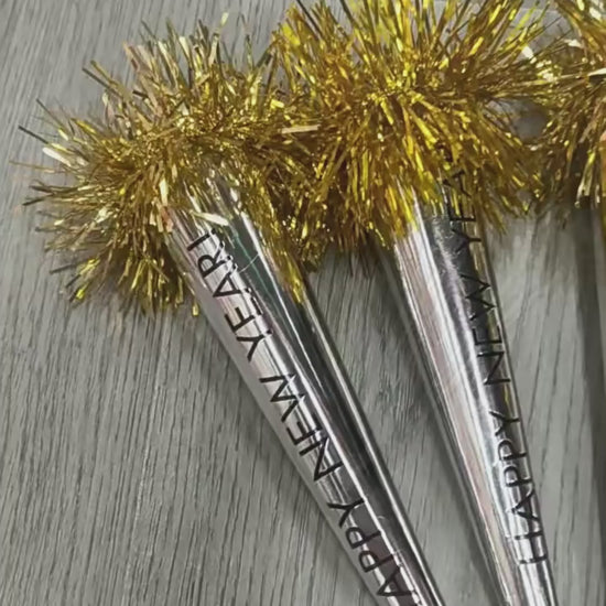 Video showing Happy New Year tassel blowouts being used as party noisemakers