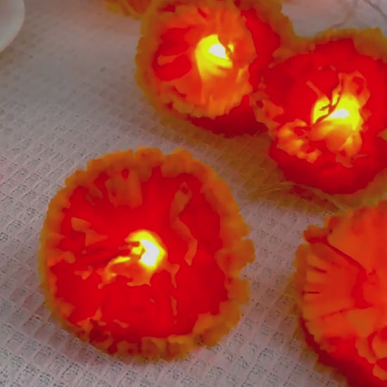 Video showing 1.5m orange marigold string lights with ten steady LEDs