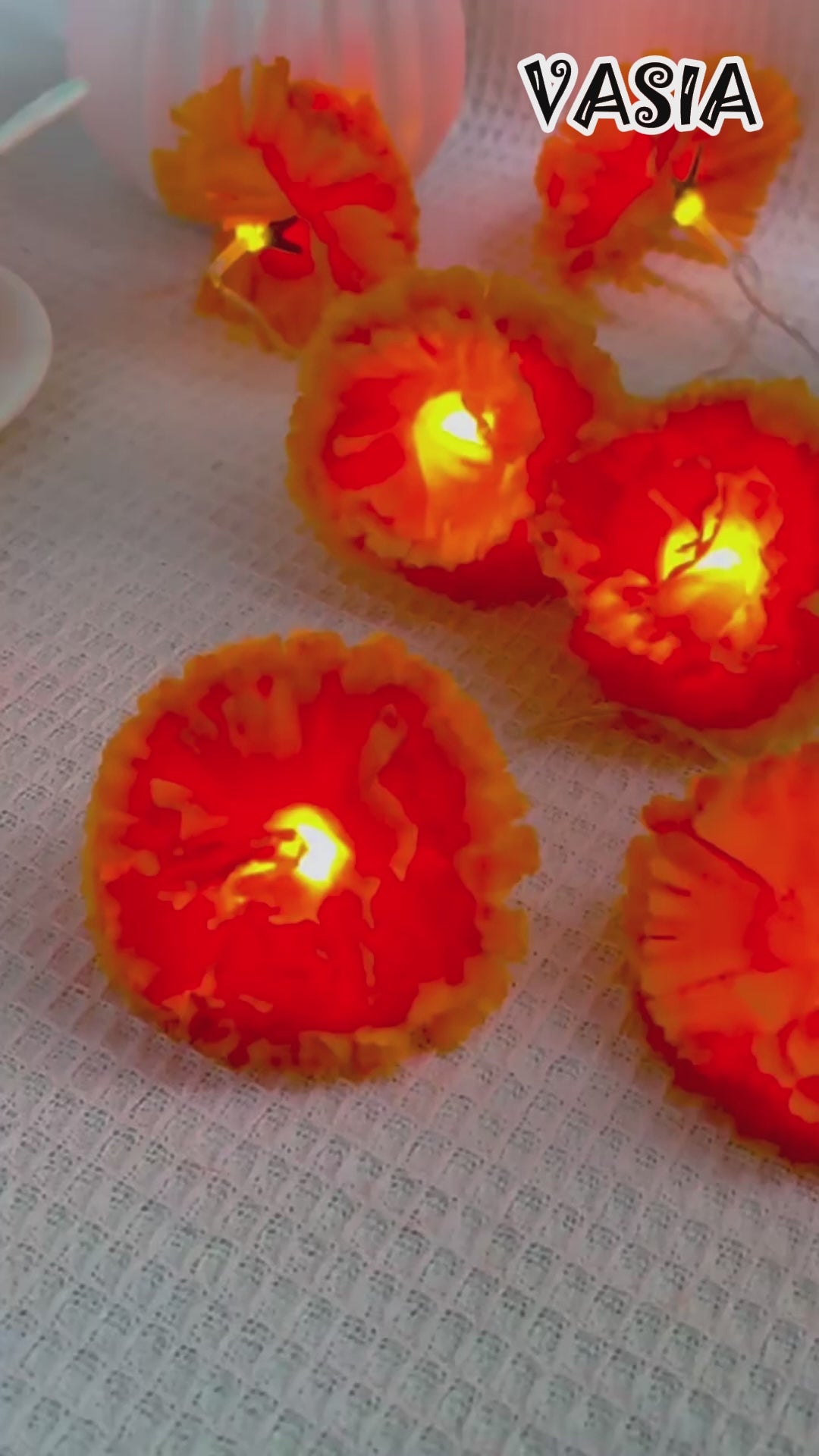 Video showing 1.5m orange marigold string lights with ten steady LEDs