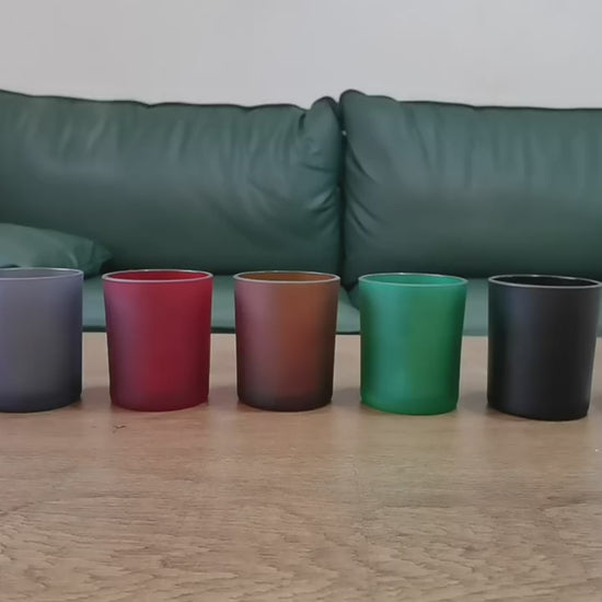 Video showing colored glass candle jars