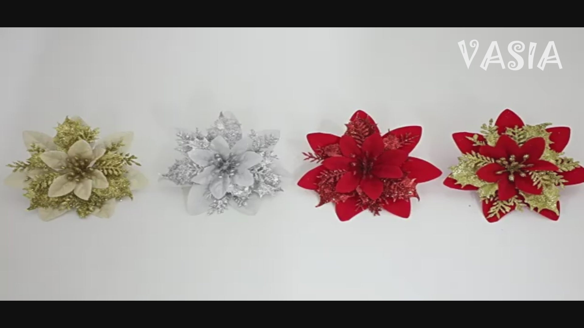 Video showing artificial poinsettia flower heads in holiday colors